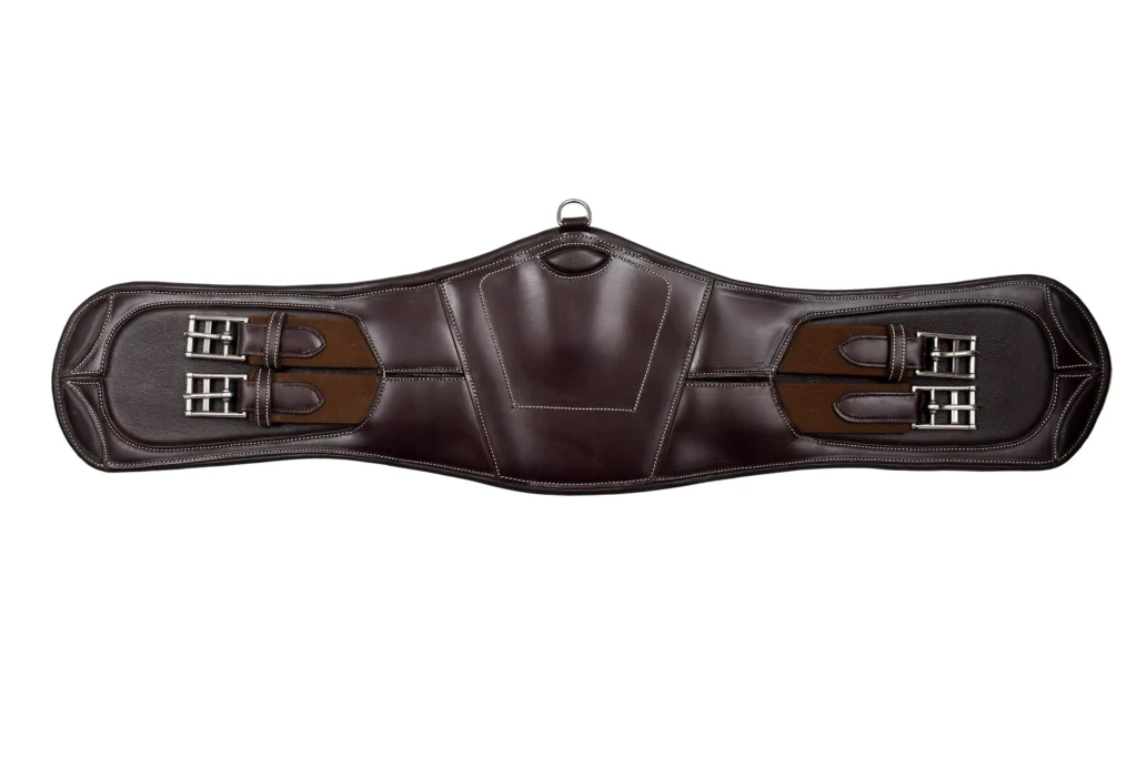 Dressage Girth - Dressage girth crafted with strong leather construction and elastic panels to support secure saddle positioning. Designed for comfortable use, it...